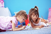 Two girls painting